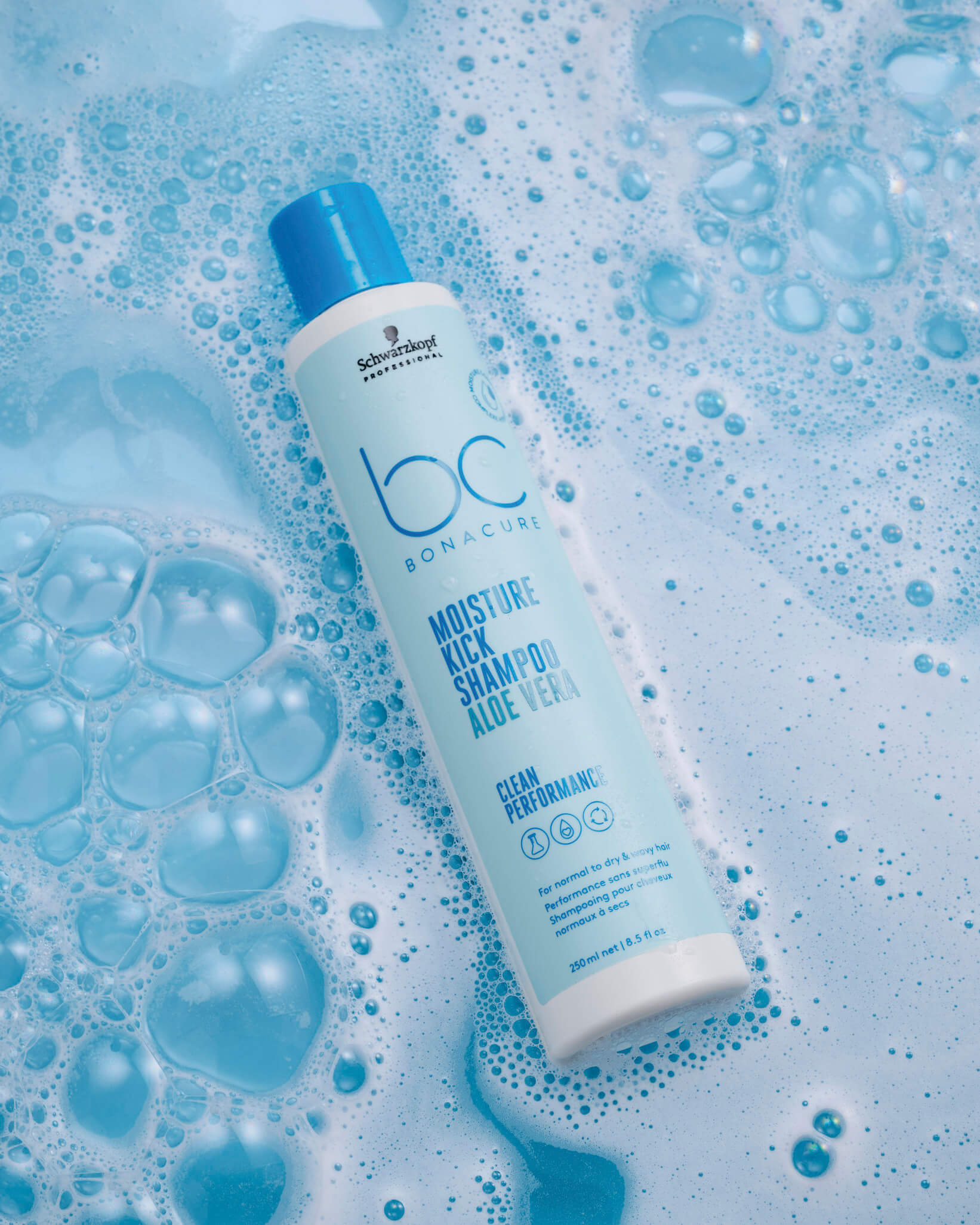 schwarzkopf-professional-bc-bonacure-moisture-kick-aloe-vera-shamppo-250-ml-flasche-plus-blauer-hintergrund-mit-schaum